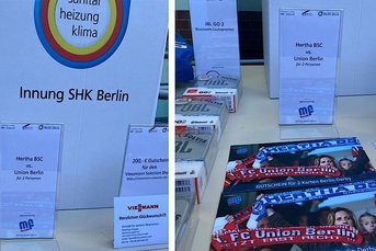 Ein Stand mit Werbeartikeln, darunter Bluetooth-Lautsprecher und Gutscheine für ein Fußballspiel zwischen Hertha BSC und Union Berlin.