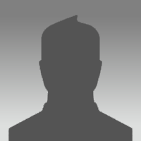 Silhouette eines Mannes vor einem grauen Hintergrund Eine dunkle Silhouette eines Mannes vor einem grauen Hintergrund, der keine klaren Gesichtszüge zeigt.