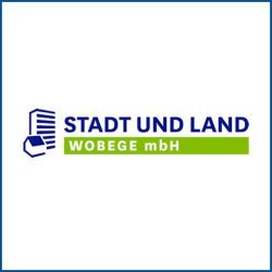 Das Logo von STADT UND LAND WOBEGE mbH zeigt eine stilisierte Stadtansicht und ein Haus in Blau und Grün.